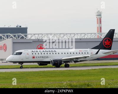 Air Canada Express Embraer E175 on the runway at the Montréal-Pierre Elliott Trudeau International Airport, Dorval, Quebec,Canada Stock Photo