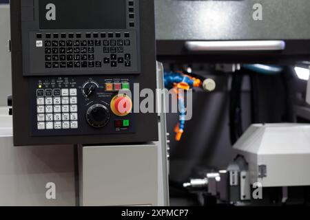 Industrial metalworking CNC lathe machine close up. Selective focus. Stock Photo