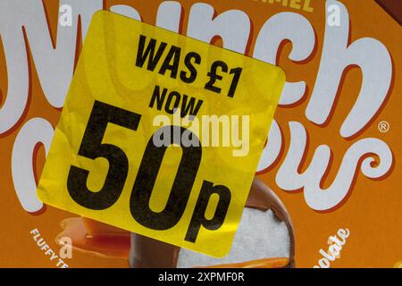 Reduced yellow sticker on ox of Salted Caramel Munch Mallow food was £1 now 50p, half price - price reduction, price mark down Stock Photo