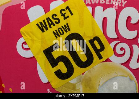 Reduced yellow sticker on box Strawberry Munch Mallow food was £1 now 50p, half price - price reduction, price mark down Stock Photo