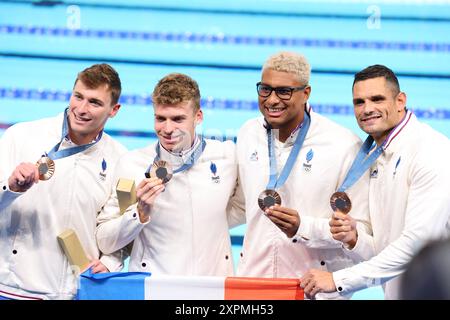 Nanterre, France. 4th Aug, 2024. (L to R) Maxime Grousset, Leon Marchand, Ndoye-Brouard, Florent Manaudou (FRA) Swimming : Men's 4x100m Medley Relay Medal Ceremony during the Paris 2024 Olympic Games at Paris La Defense Arena in Nanterre, France . Credit: YUTAKA/AFLO SPORT/Alamy Live News Stock Photo