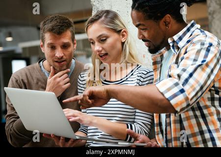 Programmers working in a software developing company office Stock Photo