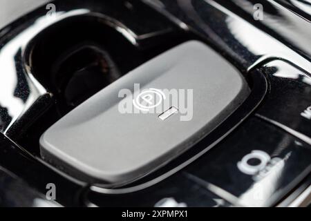 electronic handbrake button in luxury modern car Stock Photo
