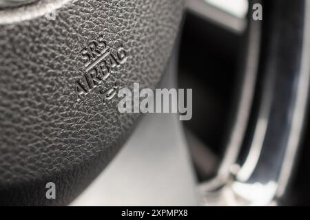 Safety airbag sign on car steering wheel with horn icon Stock Photo