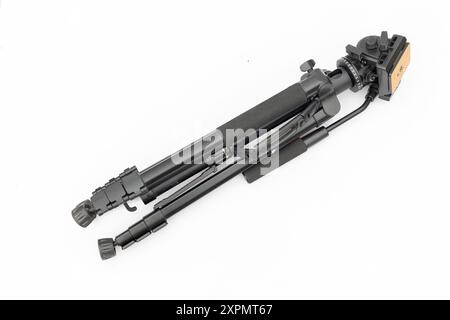 Modern tripod for camera and phone folded isolated on white background Stock Photo