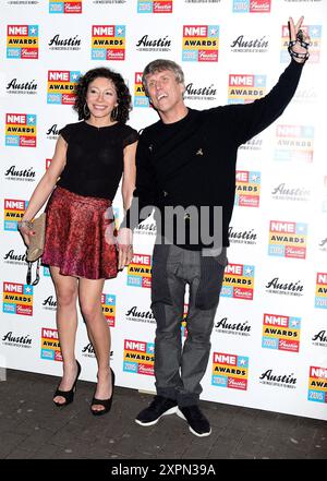 London, UK. February 18, 2015.  Firouzeh Razavi and Mark 'Bez' Berry of Happy Mondays attend the NME Awards Arrivals at Brixton Academy on February 18, 2015 in London, England, United Kingdom. Credit: S.A.M./Alamy Live News Stock Photo