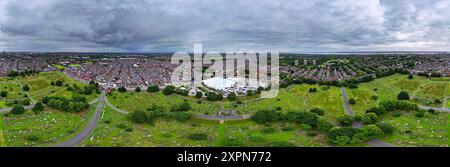 Aerial panoramic view of Toxteth Park Cemetery on Smithdown Rd Liverpool and surrounding terraced housing and Asda supermarket. Stock Photo