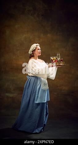 dressing up as an old lady to buy alcohol Young chubby woman, maiden, waitress, dressed old-fashion attire, tasting drinks stands on tray against vintage background Stock Photo Web Collection: Ruffles