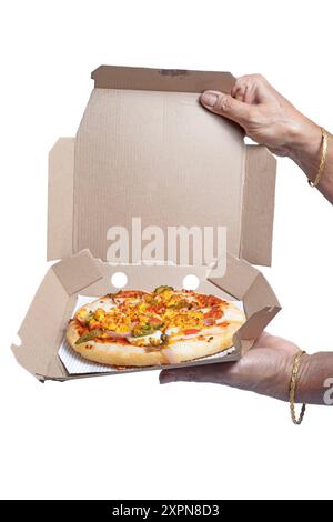 Indian woman holding open pizza box in hand on white background. vertical short Stock Photo