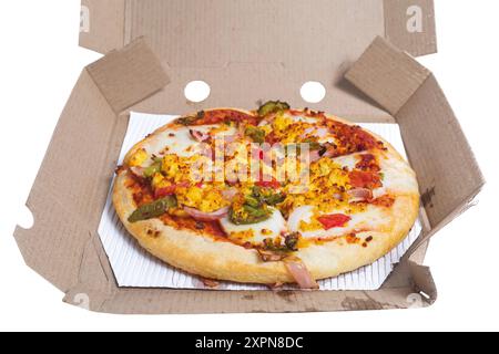 Pizza in a cardboard box isolated on a white background. Closeup Stock Photo