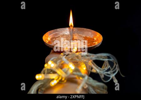 Diwali Lamps Diya with Christmas Lights in dark Night Tihar Dipawali Celebration Hindu Festival Stock Photo