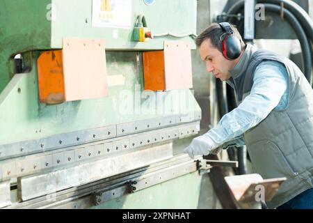 engineer checking on production in factory Stock Photo