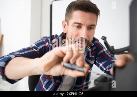 engineer repairs computers hard drive Stock Photo