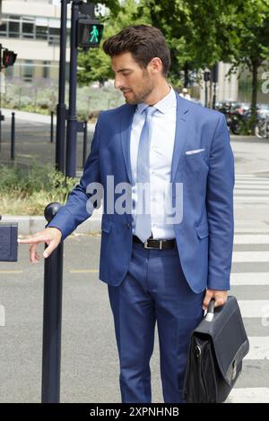 portrait of a businessman crosses the road Stock Photo