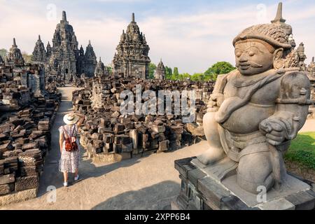 woman walking  in front of ancient sewu temple in indonesia Stock Photo