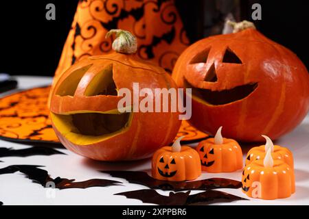 Halloween pumpkins on a black background. Halloween Sale. Stock Photo