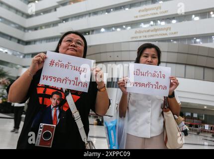 Supporter of Move Forward Party hold placards at the Constitution court. The Constitutional Court ordered the dissolution of the Move Forward Party and revoked the candidacy of the party's executive committee. The 1st and 2nd sets held office between 25 March 2021 and 31 January 2024, the period of the act that caused the dissolution of a political party, which is 10 years of offense. The executive committee of the party is prohibited from registering or participating in the establishment of a new political party for 10 years from the date of the court's order to dissolve the party'. (The Stock Photo