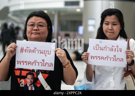 Supporters of the Move Forward Party hold placards at the Constitution court. The Constitutional Court ordered the dissolution of the Move Forward Party and revoked the candidacy of the party's executive committee. The 1st and 2nd sets held office between 25 March 2021 and 31 January 2024, the period of the act that caused the dissolution of a political party, which is 10 years of offense. The executive committee of the party is prohibited from registering or participating in the establishment of a new political party for 10 years from the date of the court's order to dissolve the party'. ( Stock Photo