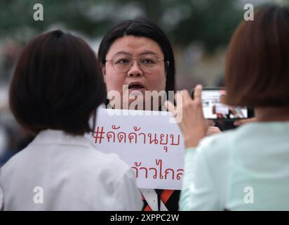 Supporter of the Move Forward Party holds a placard at the Constitution court. The Constitutional Court ordered the dissolution of the Move Forward Party and revoked the candidacy of the party's executive committee. The 1st and 2nd sets held office between 25 March 2021 and 31 January 2024, the period of the act that caused the dissolution of a political party, which is 10 years of offense. The executive committee of the party is prohibited from registering or participating in the establishment of a new political party for 10 years from the date of the court's order to dissolve the party'. Stock Photo