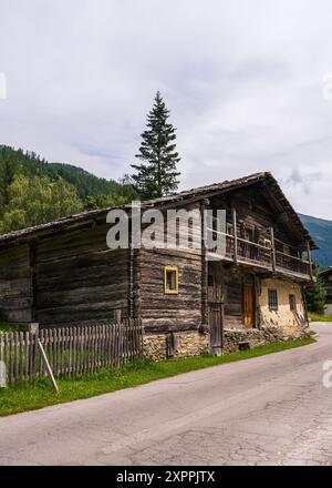 Old wooden house in a beautiful mountain landscape. Heiligenblut in Austria, Europe. Hohe Tauern. Grossglockner National Park. Austria Stock Photo