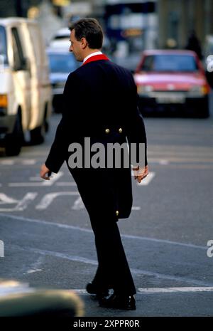 Front of House doorman, Lloyds of London Insurance Brokers, their doorman in the company livery uniform. City of London 1992 1990s UK HOMER SYKES Stock Photo