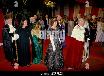 Sir Alexander Graham Lord Mayor of London and Carolyn The Lady Mayoress. Banquet at the Guildhall, City of London 1990. The Lord Mayor is with the President of Senegal make their way past a Guard of Honour into the banquet hall. 1990s UK HOMER SYKES Stock Photo