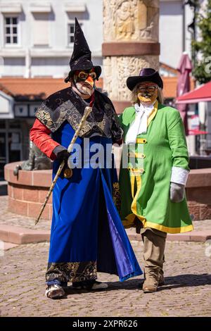 Man in the costume of the great magician and woman in the costume of  Puss in Boots, characters from the Brothers Grimm fairy tale Puss in  Boots Stock Photo - Alamy