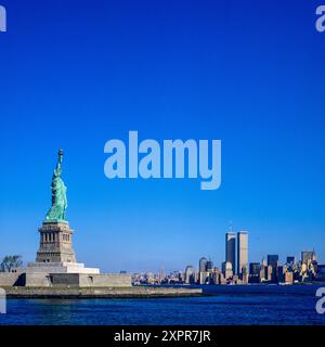 1980s Statue of Liberty, lower Manhattan skyline, WTC World Trade Center twin towers, prior to September 11 2001, New York City, NYC, NY state, USA, Stock Photo