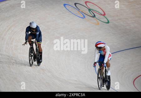 Paris, France. 7th Aug, 2024. Cristian David Ortega Fontalvo (L) of Colombia and Rayan Helal of France compete during the men's sprint 1/32 finals of cycling track at the Paris 2024 Olympic Games in Paris, France, Aug. 7, 2024. Credit: Hu Huhu/Xinhua/Alamy Live News Stock Photo