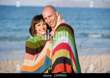 Adult, Adults, Affection, beach, beaches, Blanket, Blankets, Bond, Bonding, Bonds, Caucasian, Caucasians, Color, Colour, Contemporary, couple, couples Stock Photo