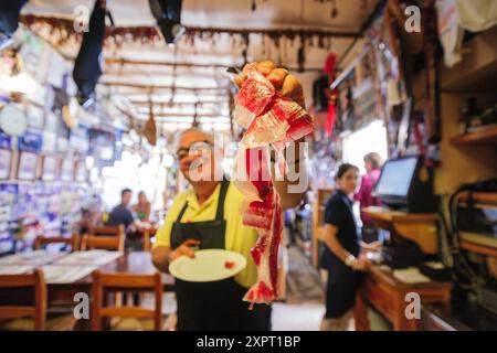 Jamon iberico cutting, Can Barahona Bodega, - Can Manolo, Ses Salines, region Migjorn, Mallorca, Balearic Islands, Spain Stock Photo