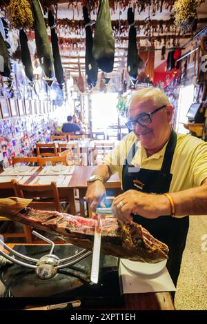 Jamon iberico cutting, Can Barahona Bodega, - Can Manolo, Ses Salines, region Migjorn, Mallorca, Balearic Islands, Spain Stock Photo