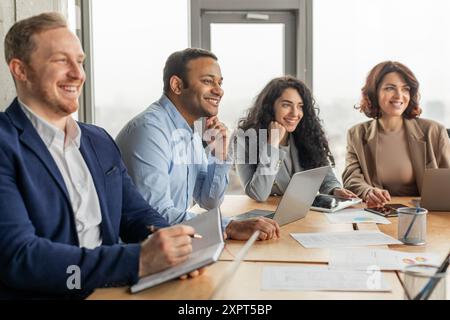Business Professionals Collaborating in Modern Office Setting Stock Photo