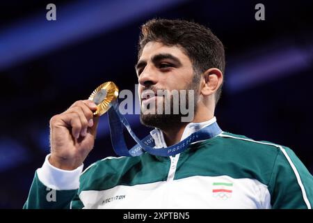 Iran's Mohammadhadi Saravi receives his gold medal for the Men's Greco ...