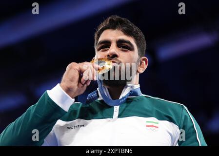 Iran's Mohammadhadi Saravi receives his gold medal for the Men's Greco ...