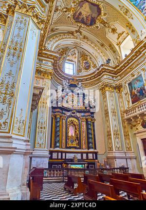 BERGAMO, ITALY - APRIL 7, 2022: The ornate side chapel in Bergamo Cathedral, decorated with sculptures, gilt patterns, Solomonic columns and frescoes, Stock Photo