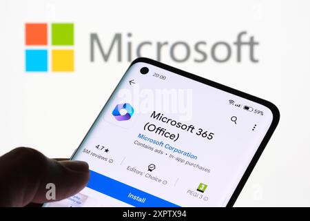 Microsoft 365 (Office) App Installation on Smartphone with Microsoft Logo in Background, Stafford, United Kingdom, August 7, 2024 Stock Photo