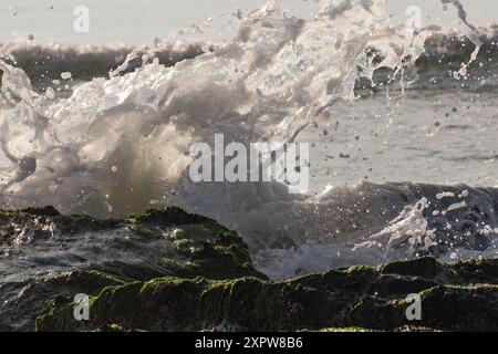 Close up of waves crashing on rocks high shutter to stop motion, Sea Isle City, NJ Stock Photo