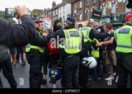 London, UK. 07th Aug, 2024. Police remove a protestor gathered for an Anti-Racism demonstration in reaction to reports of a far-right gathering. Credit: SOPA Images Limited/Alamy Live News Stock Photo