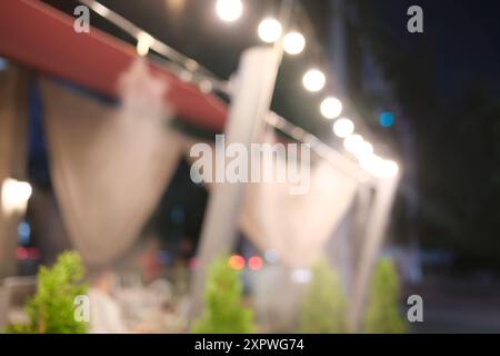 Defocused cafe at night with lights Stock Photo