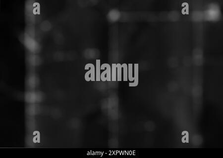 Black rough grunge old wall in blur. Abstract dark grey background Stock Photo
