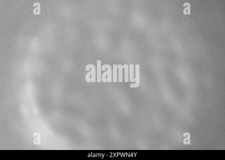 Empty ceramic gray plate with uneven textured surface close up. Minimalist gray background Stock Photo