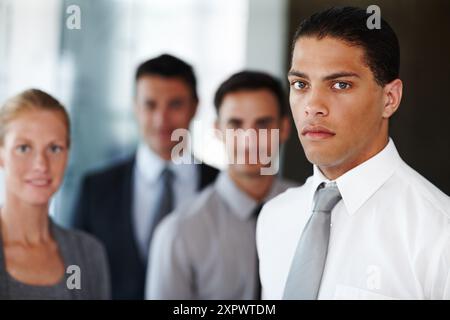 Lawyers, office and portrait of man with business people for teamwork, collaboration and legal career. Corporate attorney, law firm and workers with Stock Photo