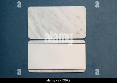 White marble blank business cards on blue background Stock Photo