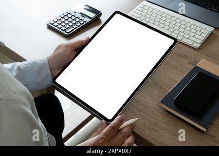 Top view businessman Hands holding digital tablet with mockup of blank Stock Photo