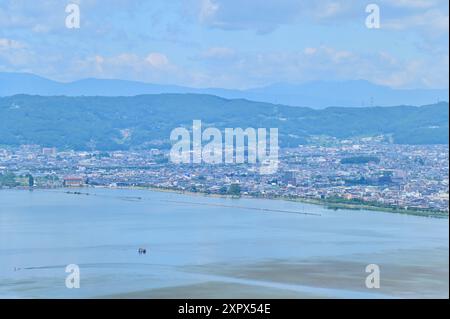 Aerial View of Cityscape of Suwa City and Lake Suwa in Nagano, Japan Stock Photo