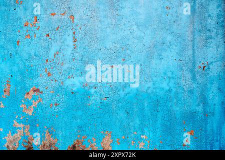 Blue cracked chipped paint pattern on wooden door as background Stock Photo