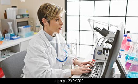 Hispanic woman scientist with short blonde hair wearing lab coat and ...