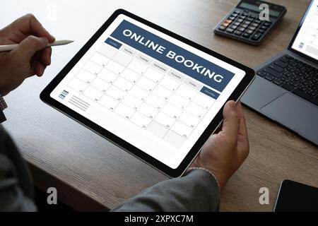 Booking Meeting Appointment Computer Online On digital tablet at office book appointment Stock Photo