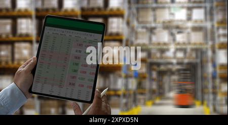 man working with tablet in warehouse Smart warehouse management system Stock Photo